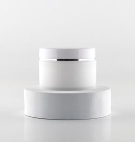 White plastic scrub cream bottle